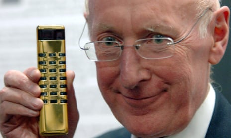 Sir Clive Sinclair displaying a gold Sinclair calculator  in 2006.