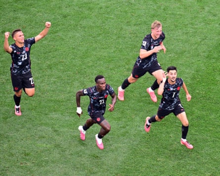 Stephen Eustáquio (right) celebrates after scoring for Canada in stoppage time at the Los Angeles Stadium.