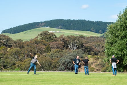 Bob Dawson, Carl Hansen, Daryl Rooks and Greg Polson on the oval at Cricket Willow, with Mount Franklin in the background
