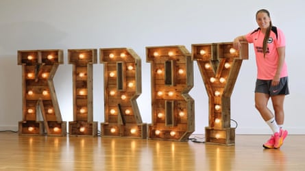 Fran Kirby stands next to large illuminated letters spelling her surname