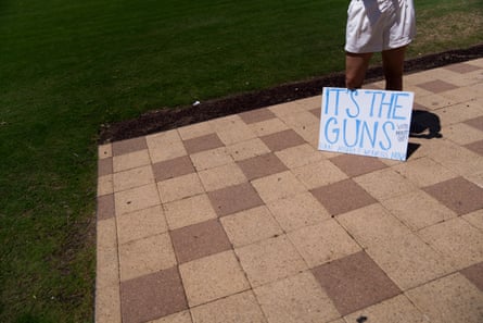 a sign reads âÂÂitâÂÂs the guns ban assault weapons nowâÂÂ