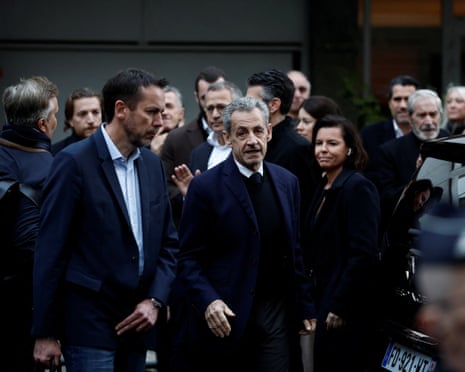 Former French president Nicolas Sarkozy is surrounded by relatives and supporters before leaving in a car on the day of his incarceration in Paris, France, 21 October 2025.