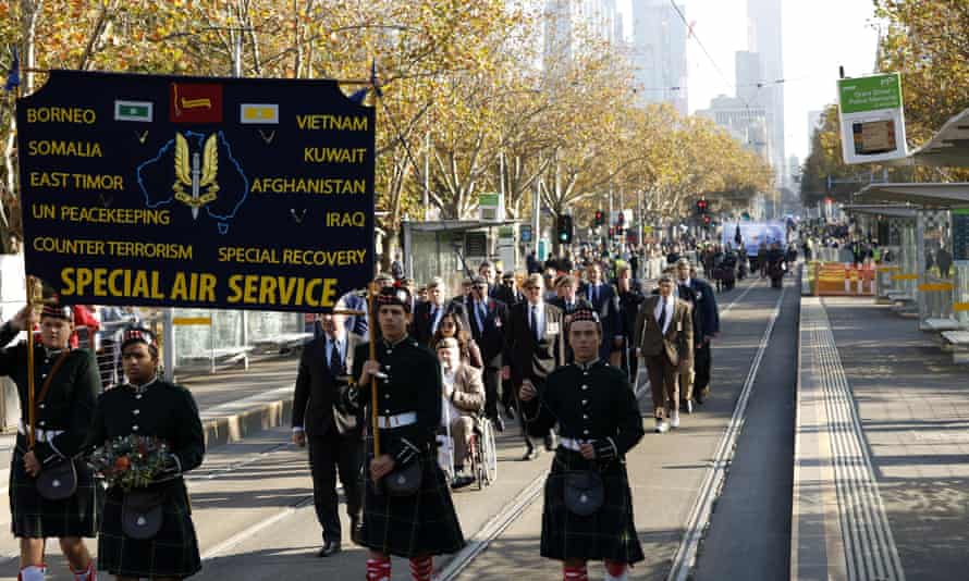 People march during Anzac Day in Melbourne, Monday, April 25, 2022.AAP Image/Con Chronis)
