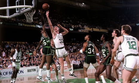 Larry Bird drives to the basket for a layup against the Milwaukee Bucks during the 1980 NBA game at the Boston Garden.