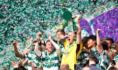 Joe Hart lifts the trophy with captain Callum McGregor (left) after winning the Scottish Premiership.