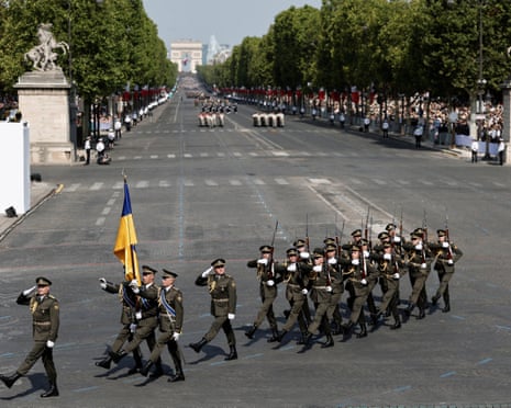 A contingent of Ukrainian soldiers march during the annual Bastille Day military parade on the Champs-Elysees avenue in Paris, France.