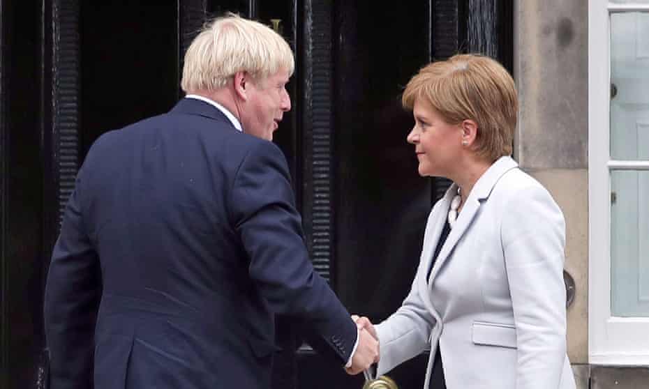 Nicola Sturgeon welcomes Boris Johnson during his trip to Scotland in July last year.