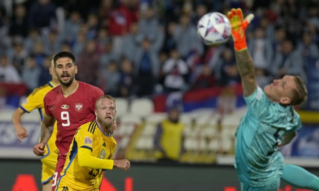 Aleksandar Mitrovic watches his header beat Sweden’s goalkeeper Robin Olsen to score the first of his three goals in a 4-1 win.