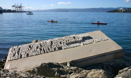 A sculpture and kayakers in Wellington Harbour