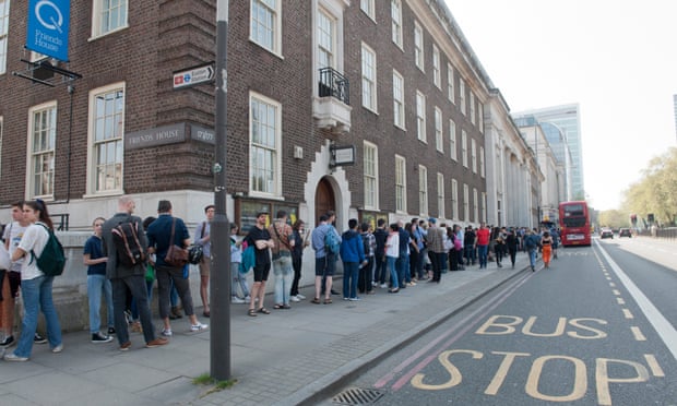 People queue outside Friends House in London