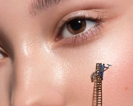 A tiny figure on a ladder appears to be cleaning or working on a person's cheek near their eye