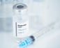 A vial of retatrutide and a syringe.