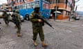 Military personnel patrol the streets in the south of Quito, Ecuador's capital. Photograph: Franklin Jacome/Agencia Press South/Getty Images)