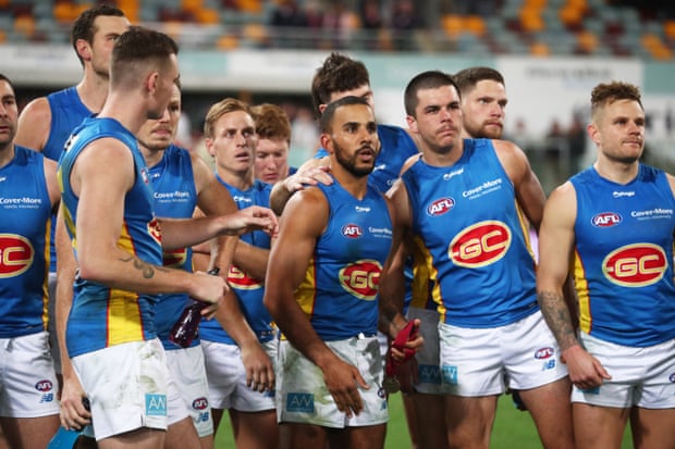 Gold Coast Suns players at the Gabba in July this year.