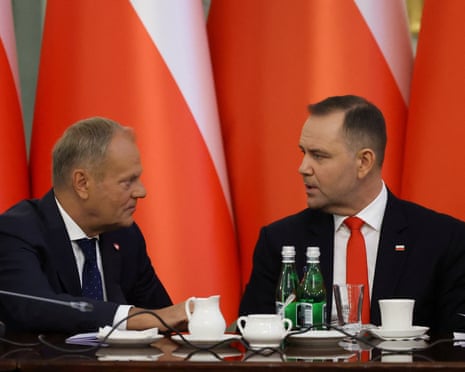 Poland's prime minister Donald Tusk speaks to President Karol Nawrocki during a Cabinet Council meeting led by the president at the Presidential Palace in Warsaw, Poland.
