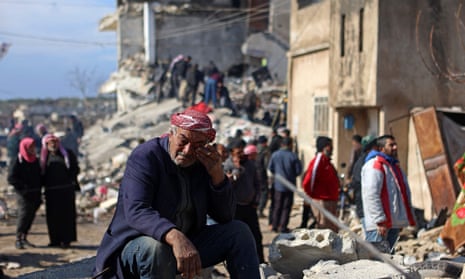 A Syrian man cries amid the rubble of a collapsed building in the rebel-held town of Jindayris.