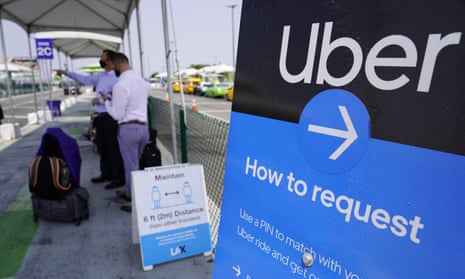 Travelers request Uber rides at Los Angeles international airport.