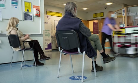 Patients sitting in an NHS waiting room