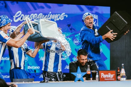 Porto players pour water over a smiling Francesco Farioli