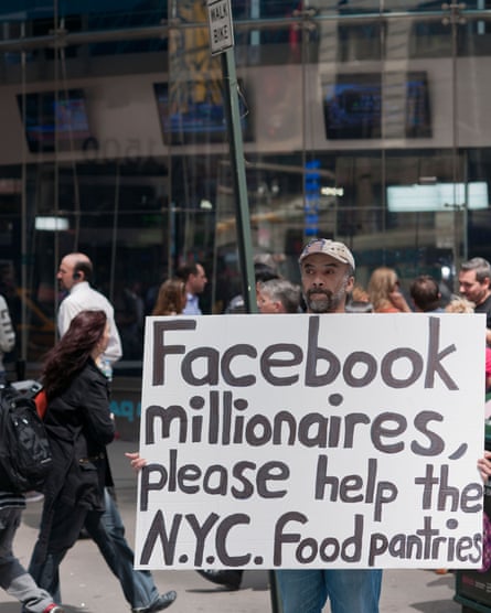 A protester outside the Nasdaq headquarters in New York marks Facebook’s IPO, 2012