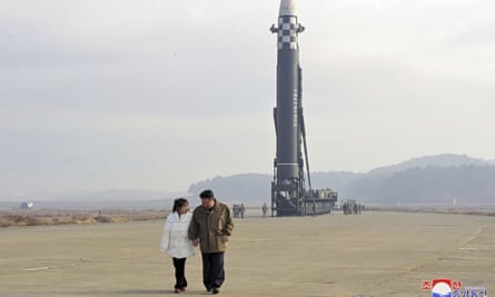 North Korean leader Kim Jong-un, along with his daughter, inspects an ICBM.