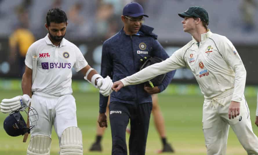 Ajinkya Rahane of India, left, is congratulated by Australian Steve Smith as he leaves the field at the end of the game.
