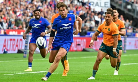 Damian Penaud runs through to collect his kick to score the second of his two tries in France’s 41-17 win over Australia in Paris.