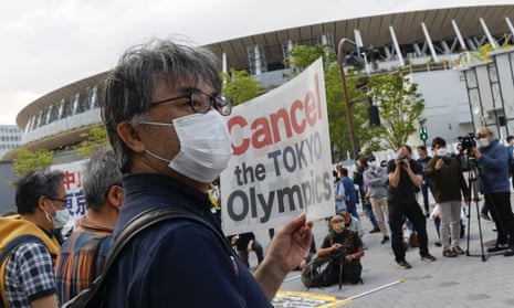 People holding placards protest against the Tokyo Olympic Games