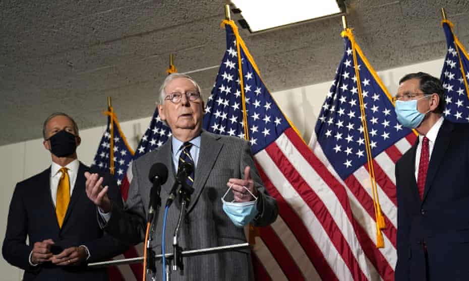 Mitch McConnell with the Republican senators John Thune and John Barrasso.