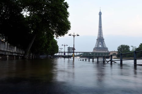 The Eiffel Tower in front of the flooded Seine river in Paris on June 3 2016
