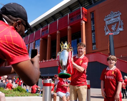 Liverpool fans with a replica Premier League trophy