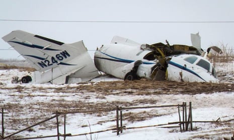 The wreckage of an airplane lies in a field in Havre-aux-Maison, Quebec. All seven people onboard the plane, including former Canadian transport minister Jean Lapierre, died in the crash.