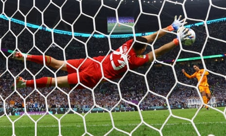  Netherlands' Virgil van Dijk has his shot saved by Argentina's Emiliano Martinez during the penalty shoot-out.