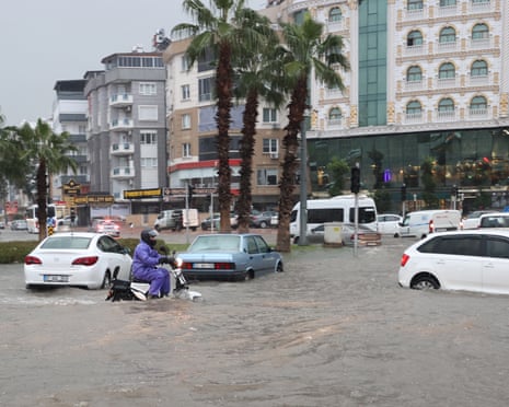 Cars wade through flooded roads due to heavy rainfall in Antalya, Turkey, in 2024.