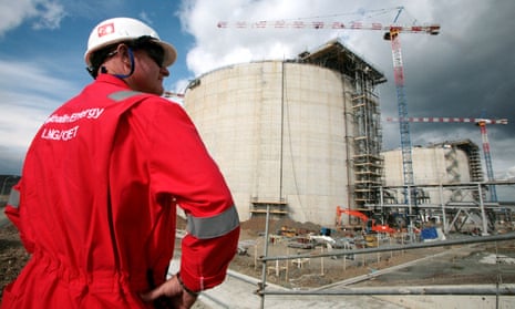 An employee of Sakhalin Energy stands at the Sakhalin-2 project's liquefaction gas plant in Prigorodnoye
