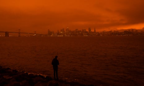 Smoke blankets the San Francisco skyline in darkness and an orange glow on 9 September.
