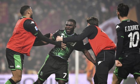 Jeremie Boga is mobbed by teammates after scoring Sassuolo’s fourth against Roma.