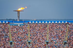 Stadium Australia, including the Olympic flame and the crowd, during the men’s hammer throw final.