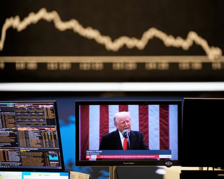Donald Trump on a TV screen with stock market data in the background