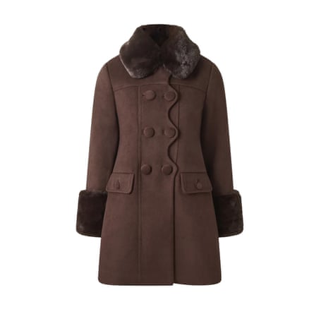 A brown double-breasted coat with a faux fur collar and cuffs on a white background