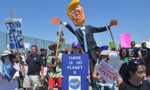 Protesters march to the Tesoro oil refinery in Los Angeles to protest against the US reliance on fossil fuels and calling attention to the issue of climate change.
