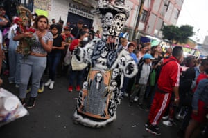 Devotees of Santa Muerte at her shrine in Mexico City on the eve of the Day of the Dead