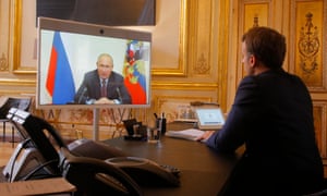 Emmanuel Macron listens to Vladimir Putin during a video call at the Elysée Palace.