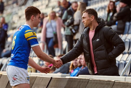 Jack Sinfield shakes hands with his dad Kevin in April 2022.