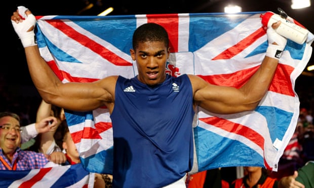 Golden gloves: Joshua defeats Italy’s Roberto Cammarelle to win the men’s super heavy final at the London Olympics.