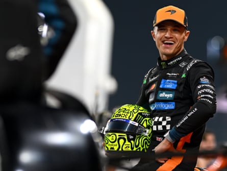 Lando Norris of Great Britain and McLaren looks on in the Pitlane