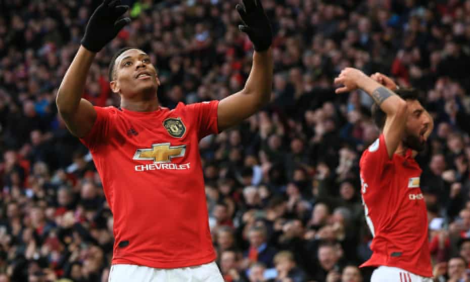Anthony Martial (left) celebrates scoring  Manchester United’s first goal, a volley from a free-kick.