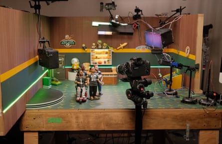 A camera shooting stop-motion animation figures on a set