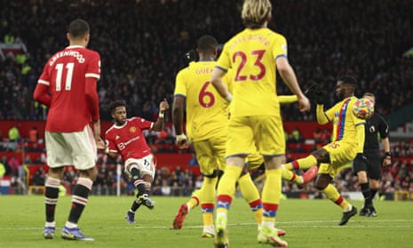 Fred of United scores through a sea of Palace players.