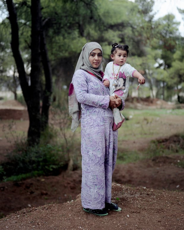 Robin Riad Dawood, 17, with her one-year-old daughter Maldan. She is now a mother of two, having given birth in Athens to a baby boy only fifteen days ago.